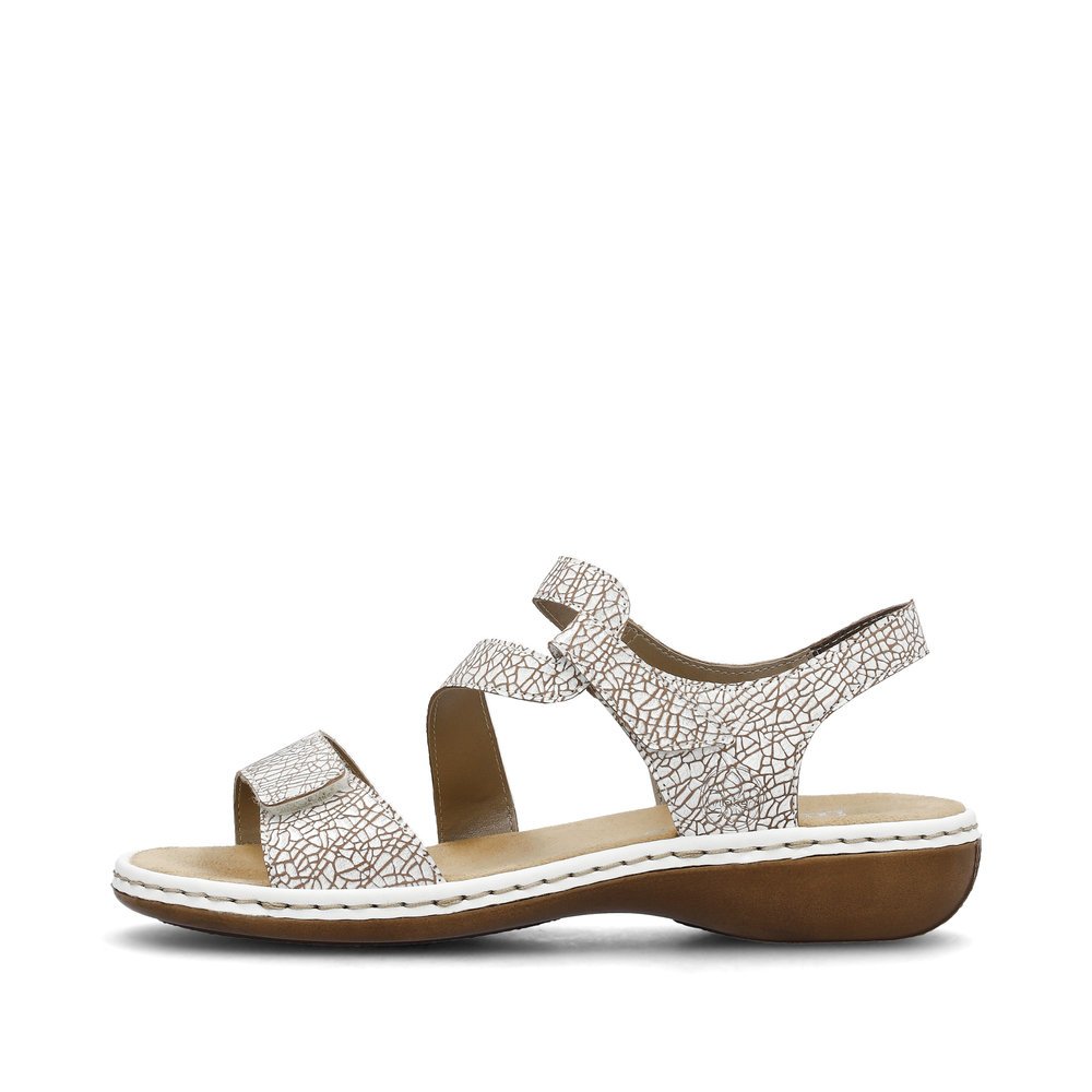 White Rieker women´s strap sandals 659C7-81 with a hook and loop fastener. Outside of the shoe.
