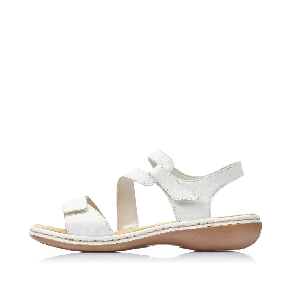 White Rieker women´s strap sandals 659C7-80 with a hook and loop fastener. Outside of the shoe.