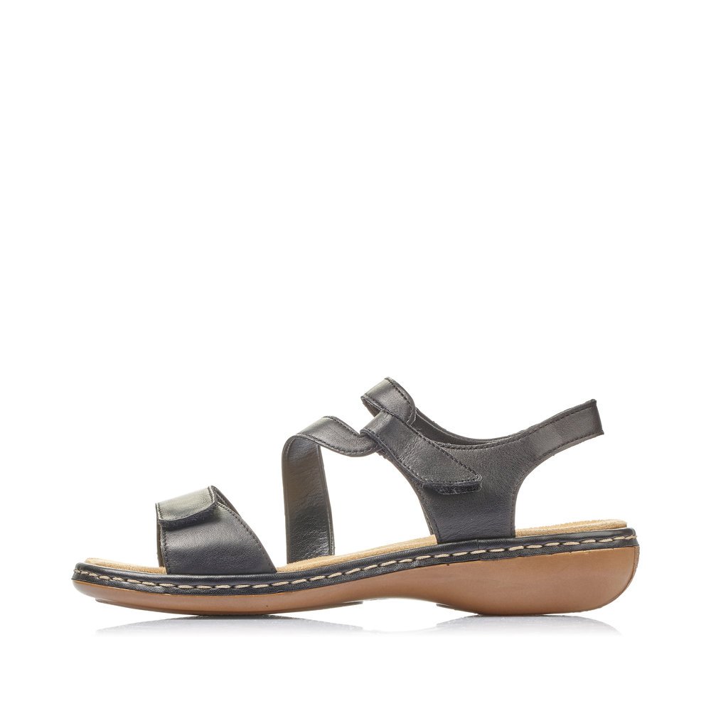 Jet black Rieker women´s strap sandals 659C7-00 with a hook and loop fastener. Outside of the shoe.
