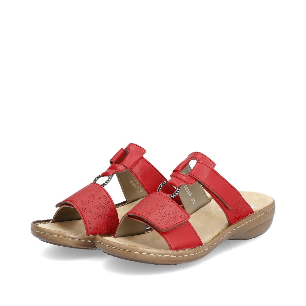 Cherry red Rieker women´s mules 60885-33 with a hook and loop fastener. Shoes laterally.