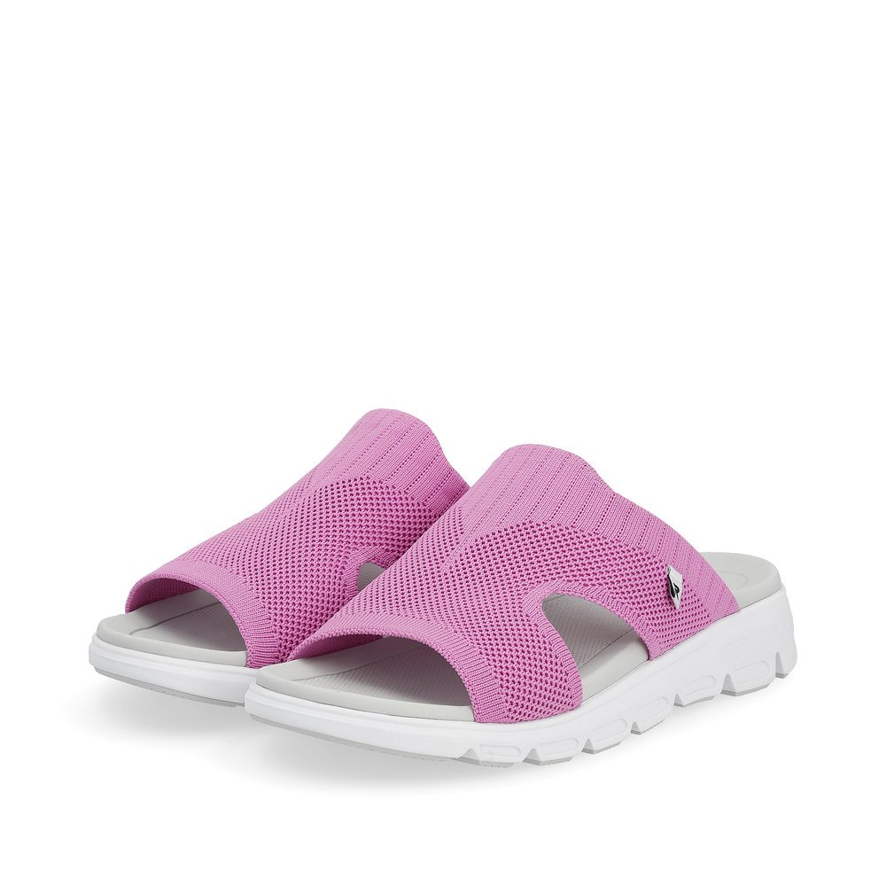 Pink washable Rieker women´s mules V8451-30 with a flexible and super light sole. Shoes laterally.