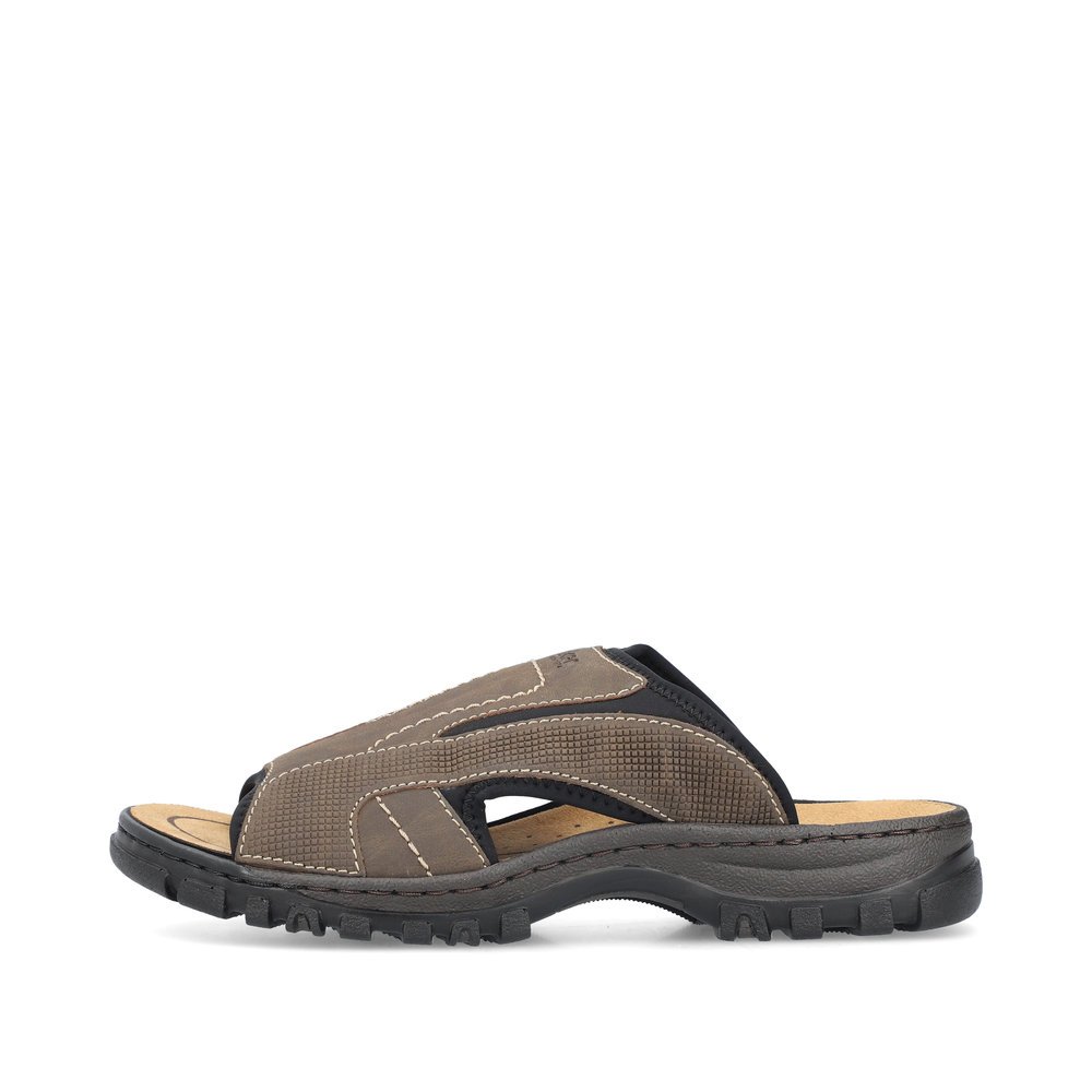 Brown-grey Rieker men´s mules 25093-25 with an elastic insert. Outside of the shoe.