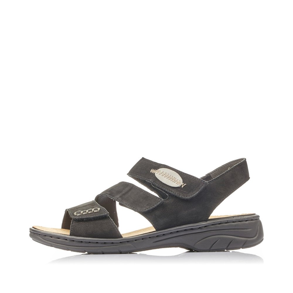 Jet black Rieker women´s strap sandals 64573-00 with a hook and loop fastener. Outside of the shoe.