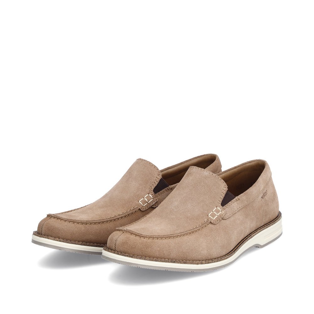 Brown Rieker men´s slippers 12551-64 with an elastic insert. Shoes laterally.