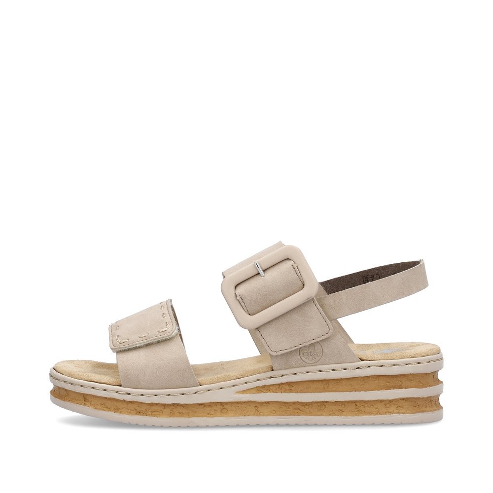 Light beige Rieker women´s wedge sandals 62950-62 with a hook and loop fastener. Outside of the shoe.