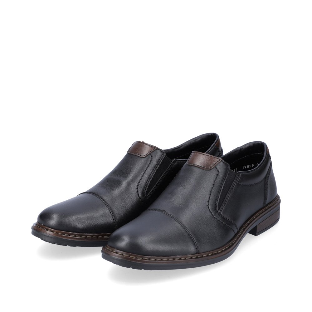 Black Rieker men´s slippers 17659-00 with elastic insert as well as extra width H. Shoes laterally.
