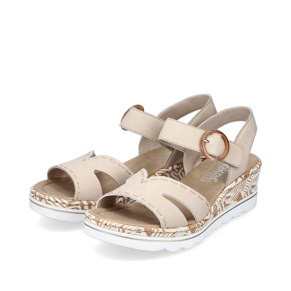 Beige Rieker women´s wedge sandals 67173-60 with a hook and loop fastener. Shoes laterally.