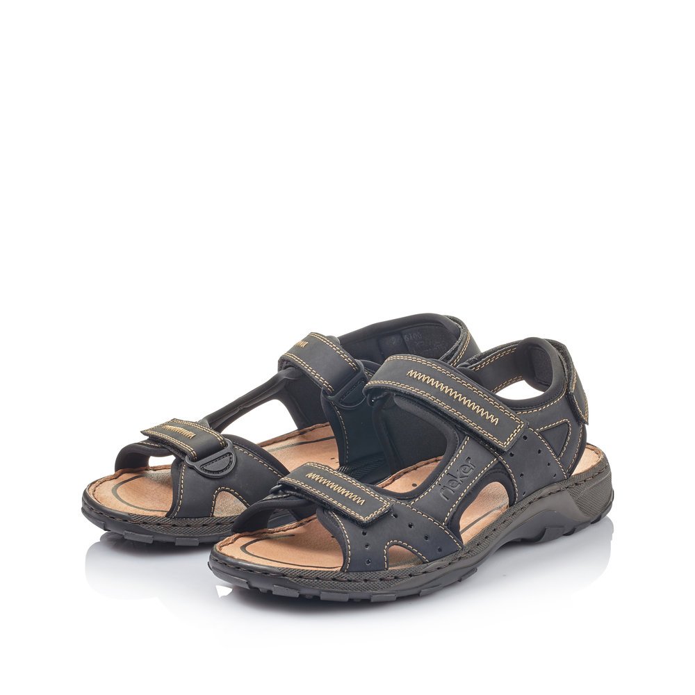 Black Rieker men´s hiking sandals 26061-00 with a hook and loop fastener. Shoes laterally.