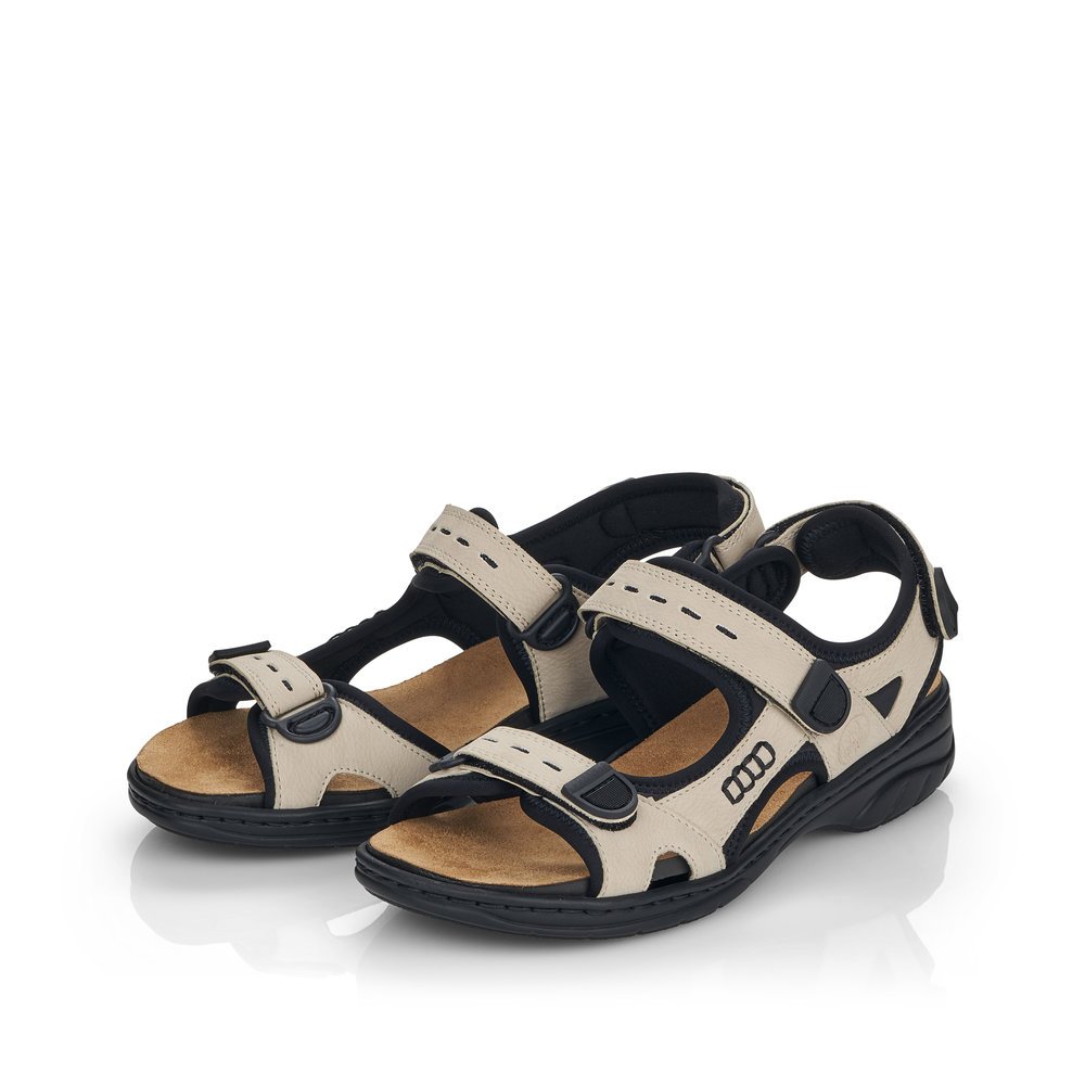 Beige Rieker women´s hiking sandals 64582-60 with a hook and loop fastener. Shoes laterally.