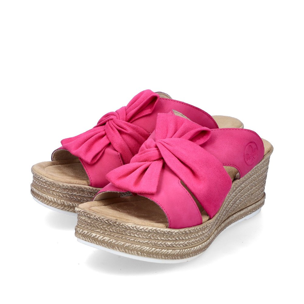 Pink Rieker women´s mules 68789-31 with decorative bow. Shoes laterally.