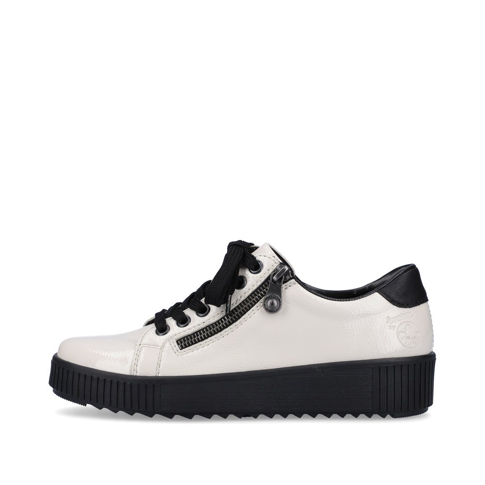 Dirty white Rieker women´s sneakers M6404-80 with lacing and zipper. The outside of the shoe