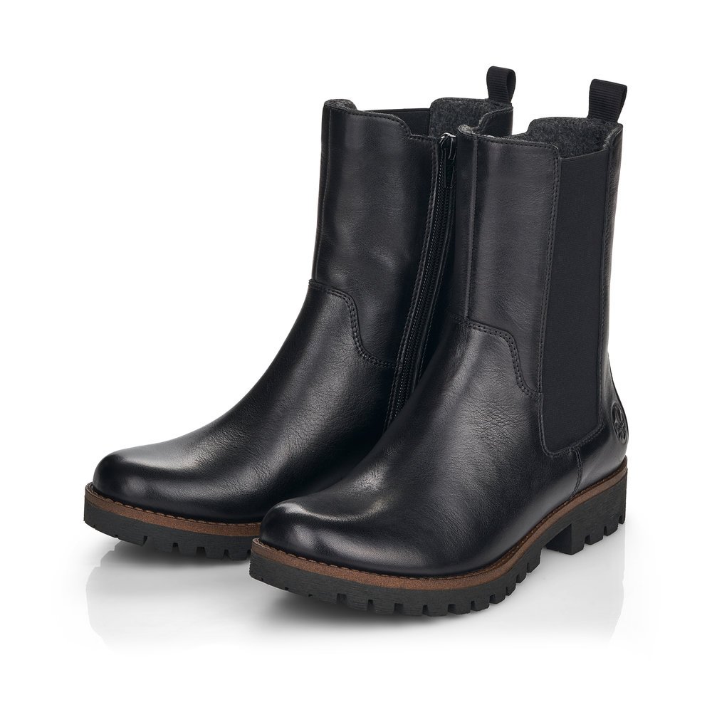 Jet black Rieker women´s Chelsea boots 78590-00 with zipper as well as profile sole. Shoe laterally