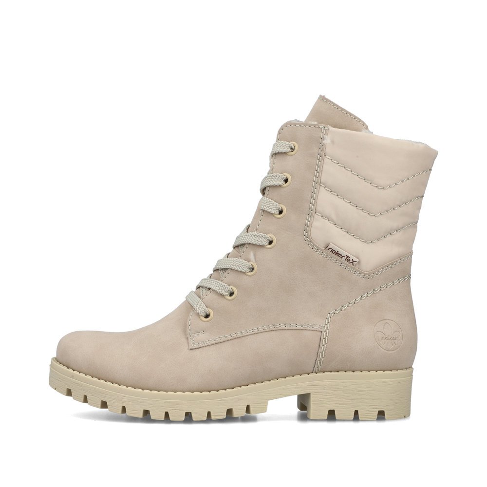 Beige Rieker women´s biker boots 78520-62 with lacing and zipper. The outside of the shoe