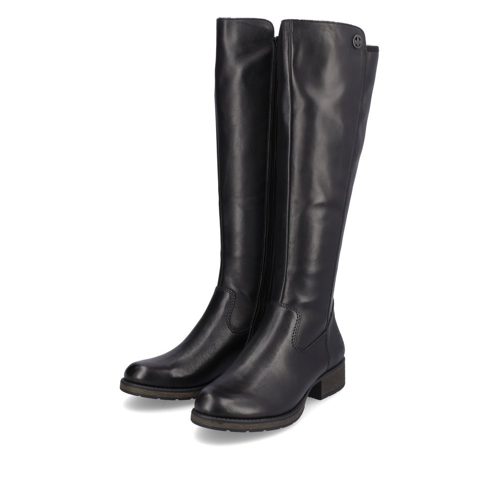 Jet black Rieker women´s high boots Z9591-01 with zipper as well as profile sole. Shoe laterally
