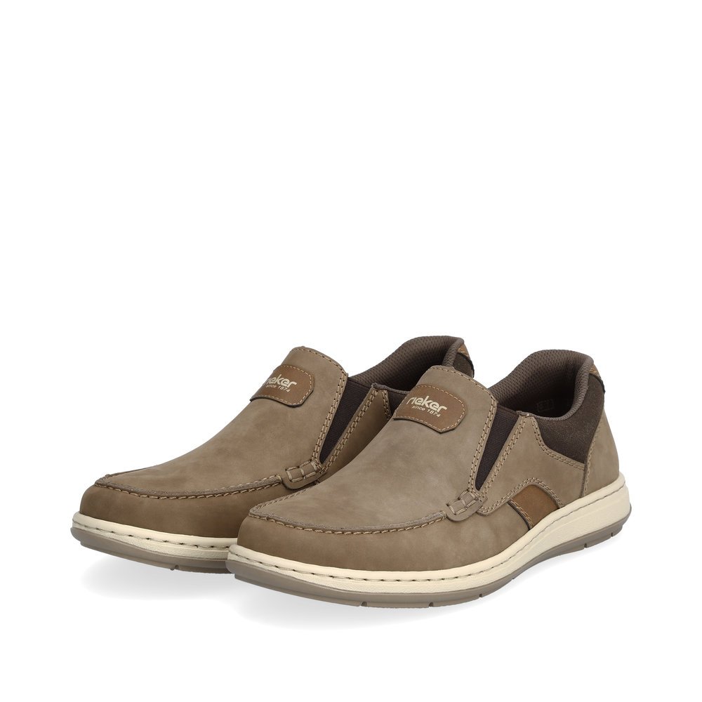 Brown Rieker men´s slippers 17368-25 with elastic insert as well as extra width H. Shoes laterally.