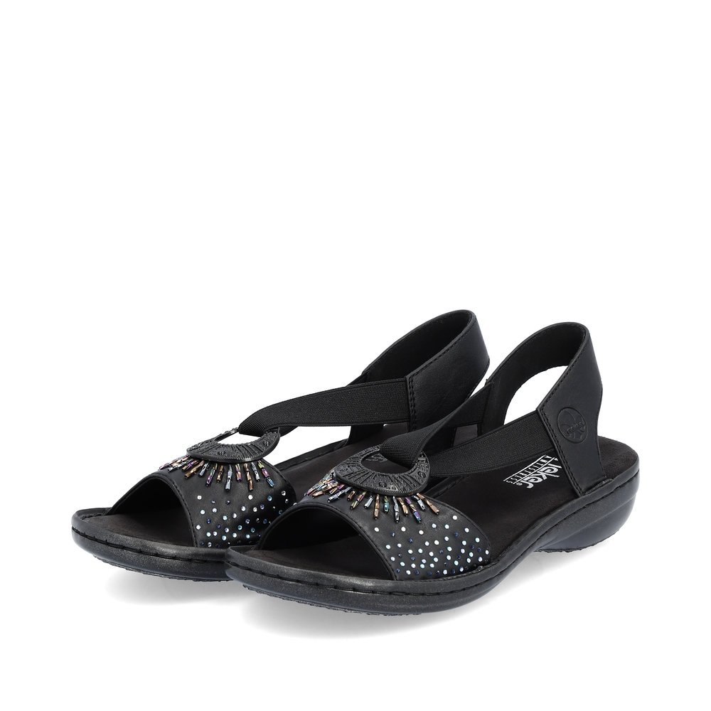 Black Rieker women´s strap sandals 60880-00 with an elastic insert. Shoes laterally.