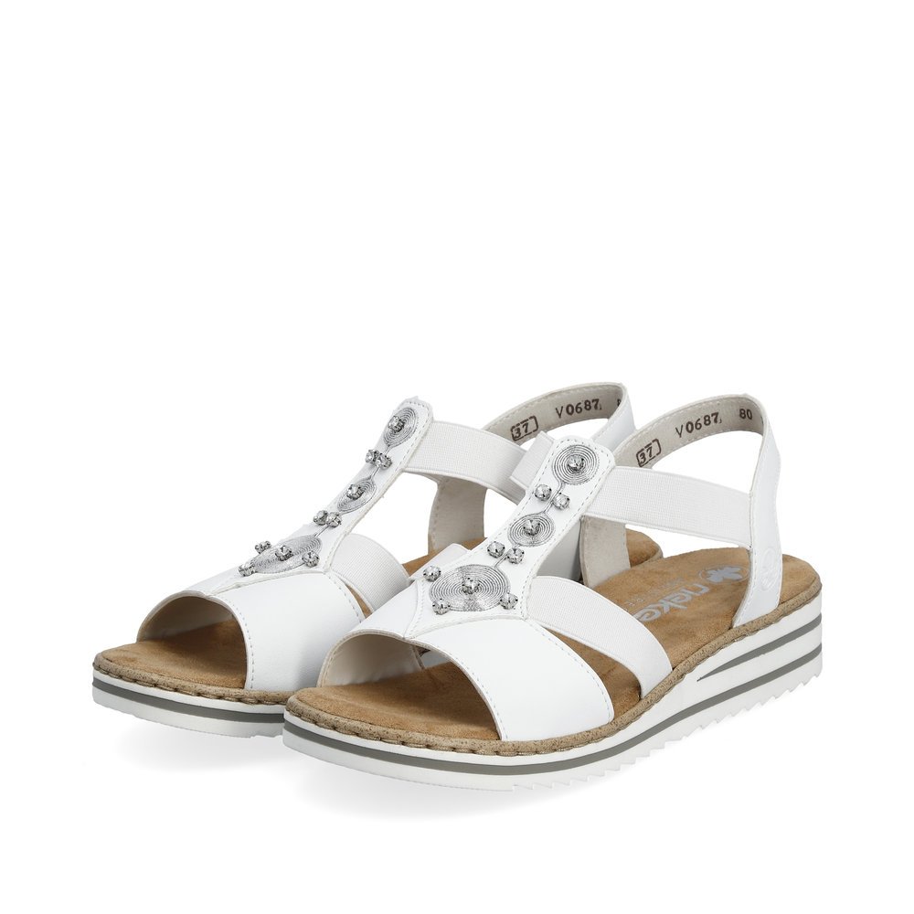 Pure white Rieker women´s wedge sandals V0687-80 with an elastic insert. Shoes laterally.