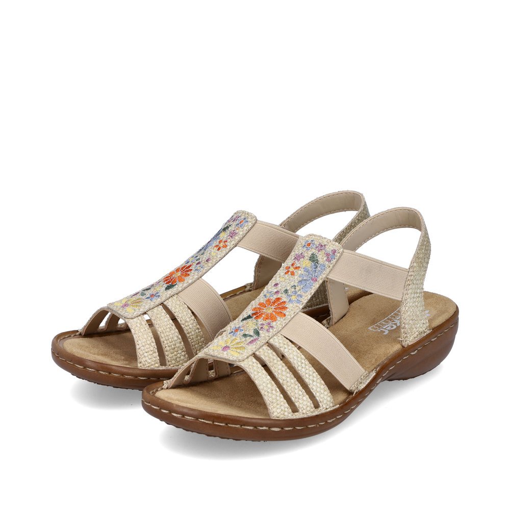 Beige Rieker women´s strap sandals 60808-60 with an elastic insert. Shoes laterally.