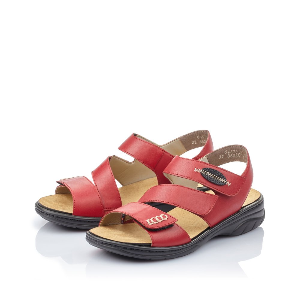 Red Rieker women´s strap sandals 64573-33 with a hook and loop fastener. Shoes laterally.