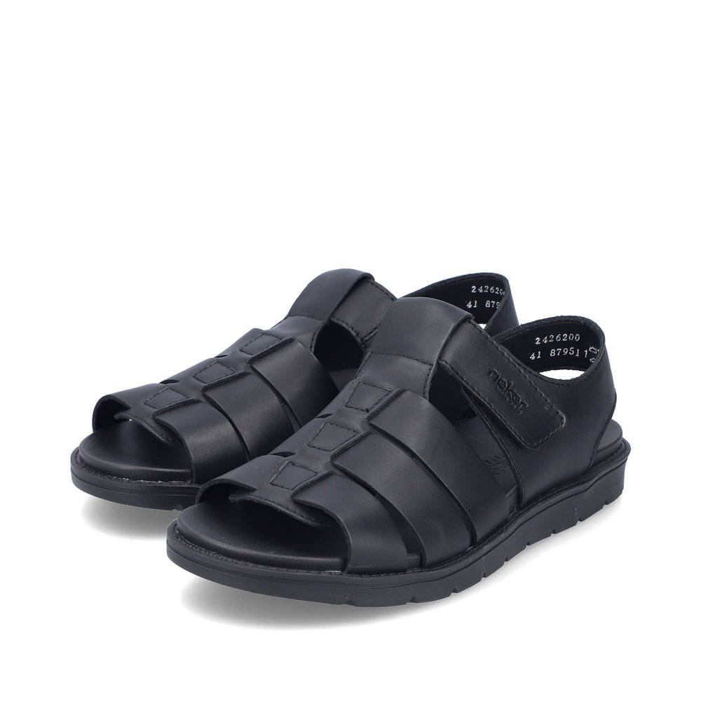Black Rieker men´s sandals 24262-00 with a hook and loop fastener. Shoes laterally.