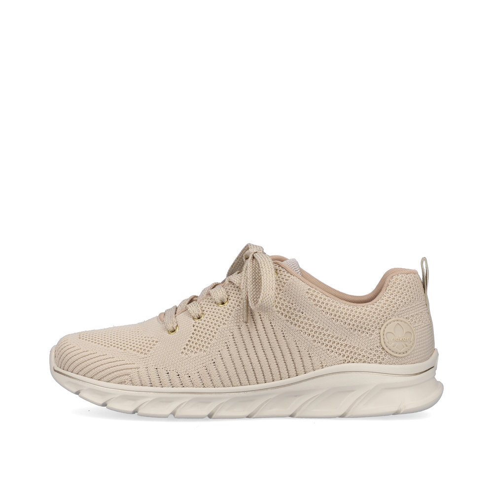 Beige Rieker women´s low-top sneakers 54022-80 with a flexible and ultra light sole. Outside of the shoe.