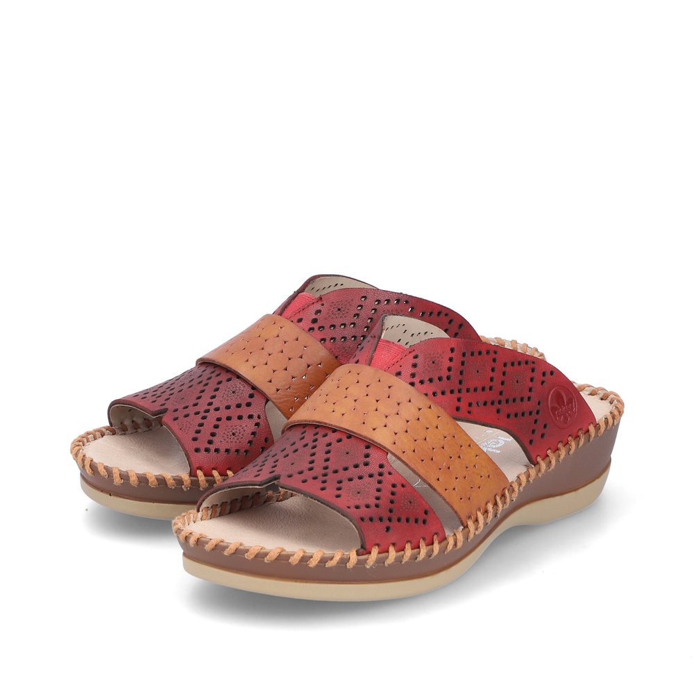 Red Rieker women´s mules 61338-35 in perforated look as well as comfort width G. Shoes laterally.
