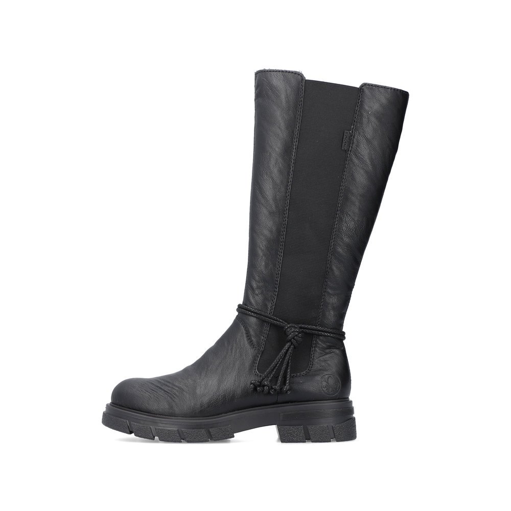 Glossy black Rieker women´s high boots Z9193-00 with zipper as well as profile sole. The outside of the shoe