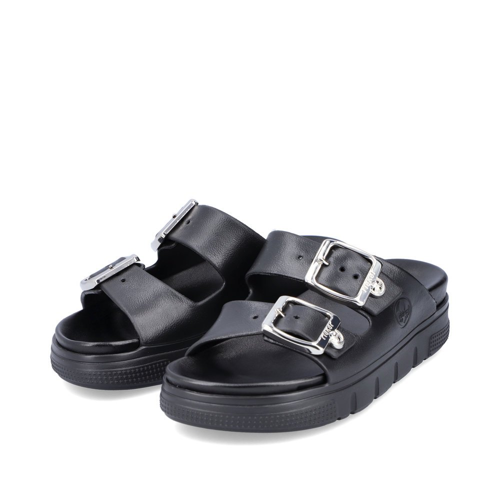Black Rieker women´s mules P2180-00 with a buckle as well as a flexible sole. Shoes laterally.