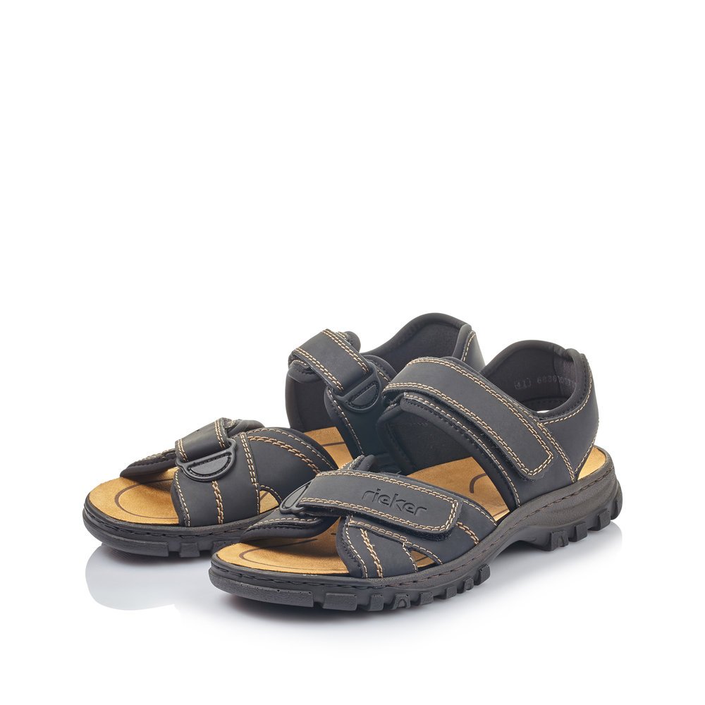 Black Rieker men´s hiking sandals 25051-01 with a hook and loop fastener. Shoes laterally.