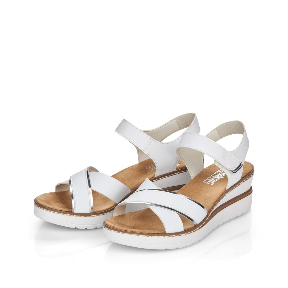 White Rieker women´s wedge sandals V38G9-80 with a hook and loop fastener. Shoes laterally.