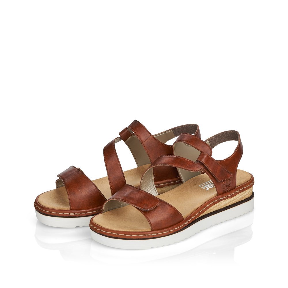 Espresso brown Rieker women´s wedge sandals 679C7-24 with a hook and loop fastener. Shoes laterally.
