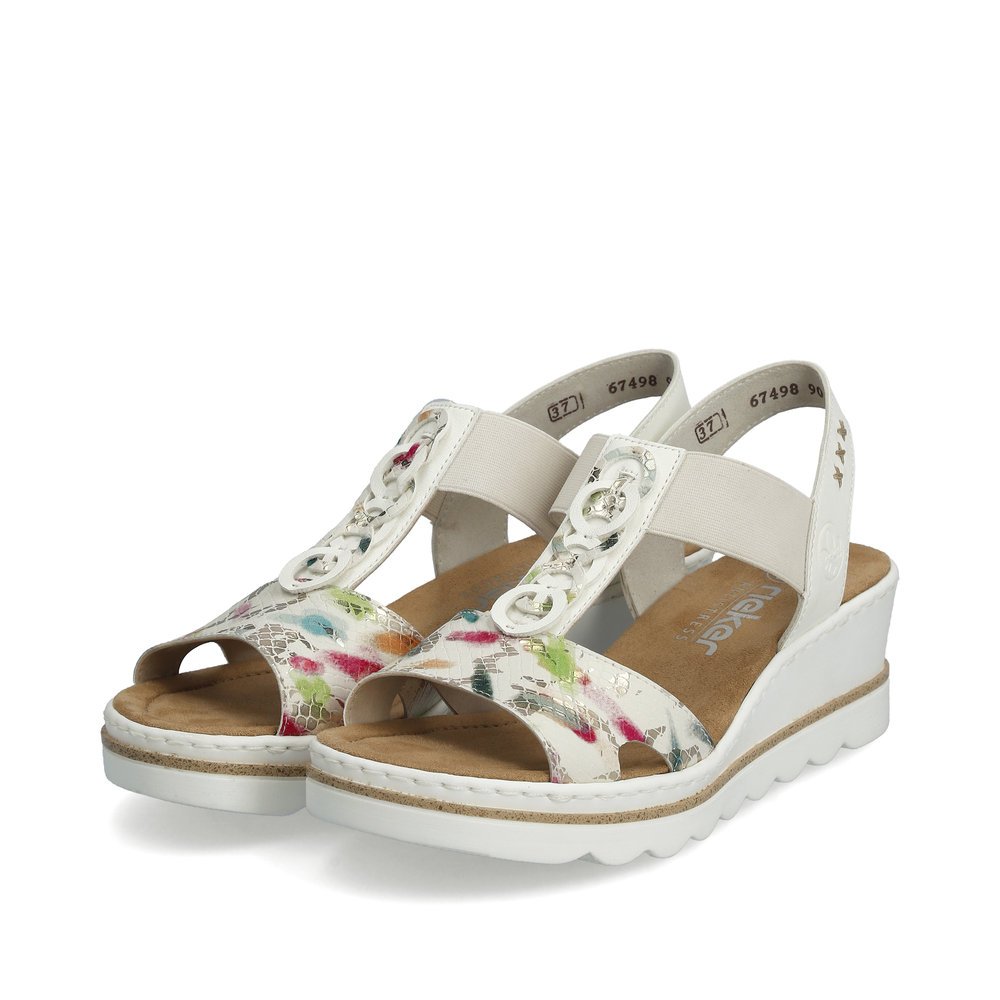 Off-white Rieker women´s wedge sandals 67498-90 with an elastic insert. Shoes laterally.