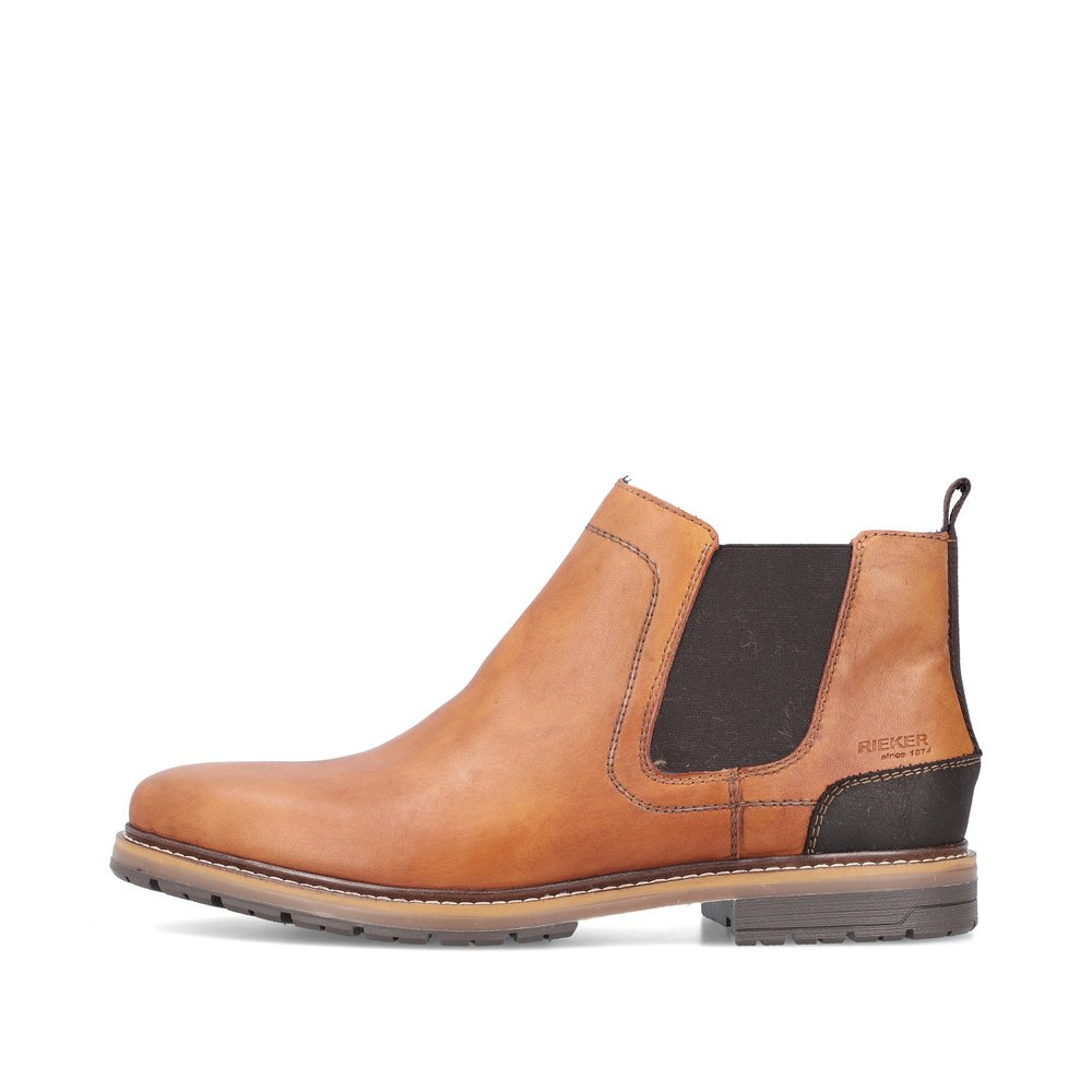Camel brown Rieker men´s Chelsea boots 13751-24 with zipper as well as profile sole. The outside of the shoe