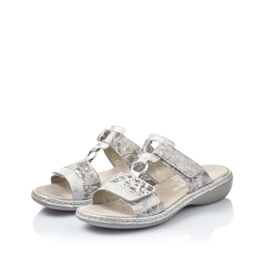 Silver Rieker women´s mules 659X6-80 with a hook and loop fastener. Shoes laterally.