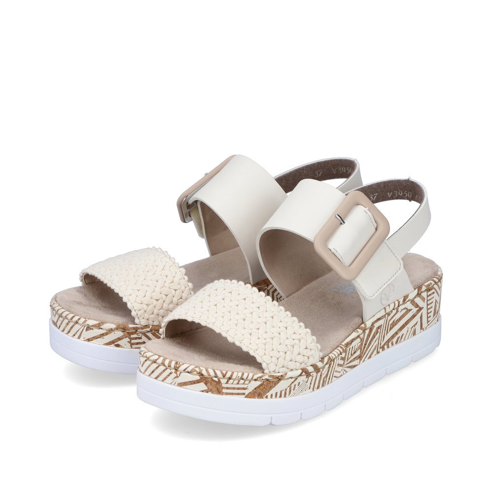 Light beige Rieker women´s wedge sandals V3950-61 with a hook and loop fastener. Shoes laterally.