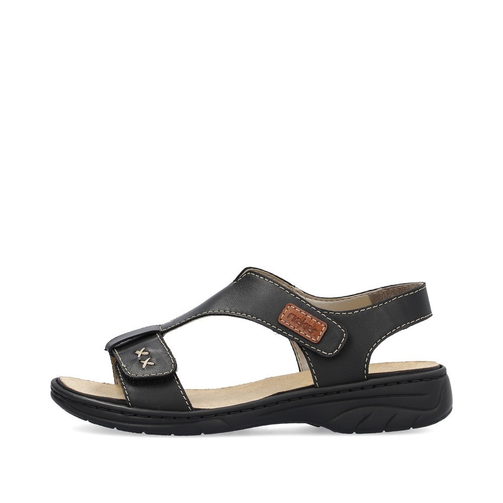 Black Rieker women´s strap sandals 64577-00 with a hook and loop fastener. Outside of the shoe.