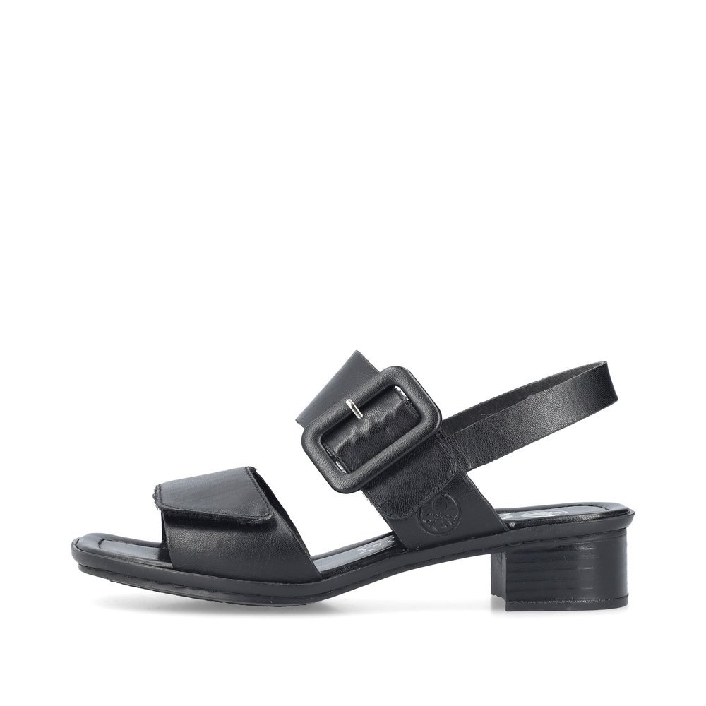 Glossy black Rieker women´s strap sandals 62663-01 with a hook and loop fastener. Outside of the shoe.