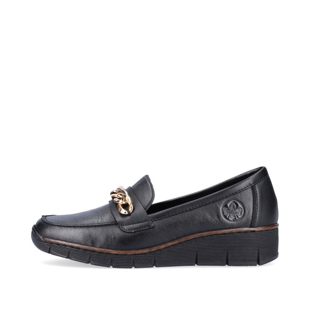 Jet black Rieker women´s loafers 53777-00 with shock-absorbing sole with wedge heel. The outside of the shoe