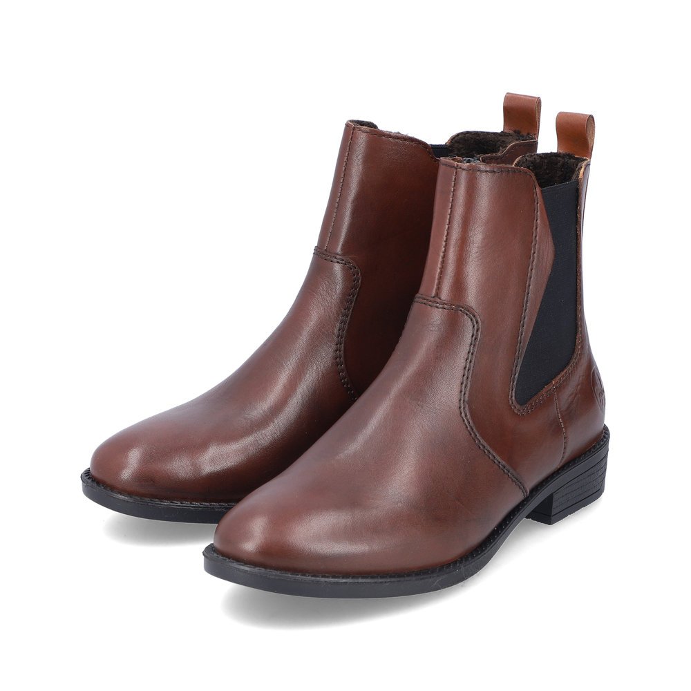 Maroon Rieker women´s Chelsea boots 73694-25 with a zipper as well as profile sole. Shoe laterally