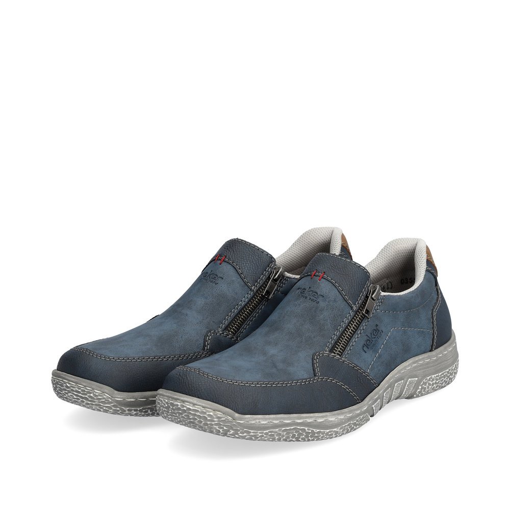 Blue-grey Rieker men´s slippers 03550-14 with a zipper as well as perforated look. Shoes laterally.