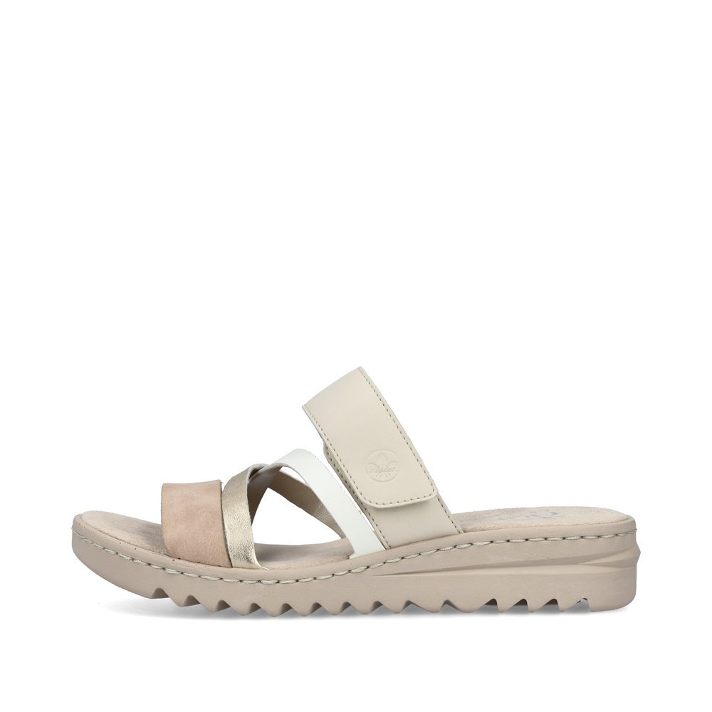 Beige Rieker women´s mules V4652-90 with a hook and loop fastener. Outside of the shoe.