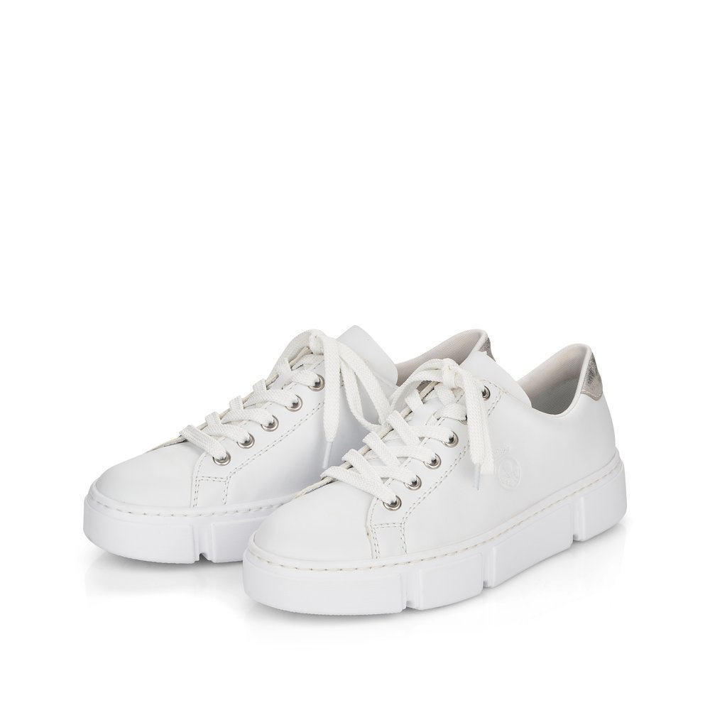 Pure white Rieker women´s low-top sneakers N59W1-80 with lacing. Shoes laterally.