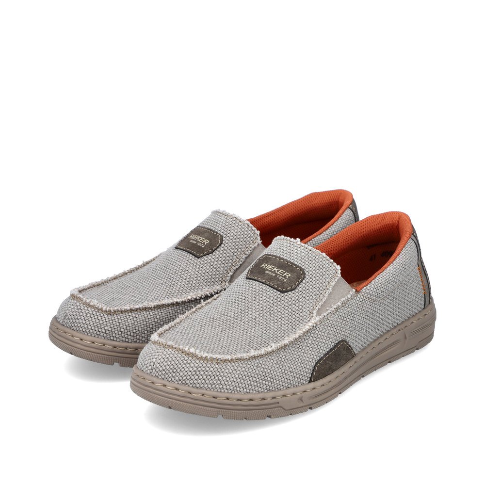 Beige Rieker men´s slippers 08651-62 with elastic insert as well as extra width H. Shoes laterally.