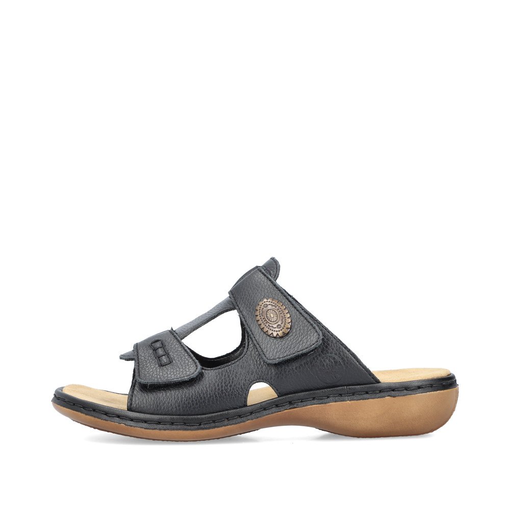 Black Rieker women´s mules 65958-00 with a hook and loop fastener. Outside of the shoe.