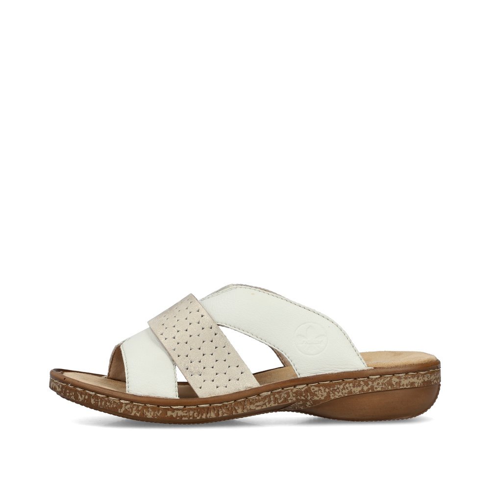 White Rieker women´s mules 62897-80 in perforated look as well as slim fit E 1/2. Outside of the shoe.