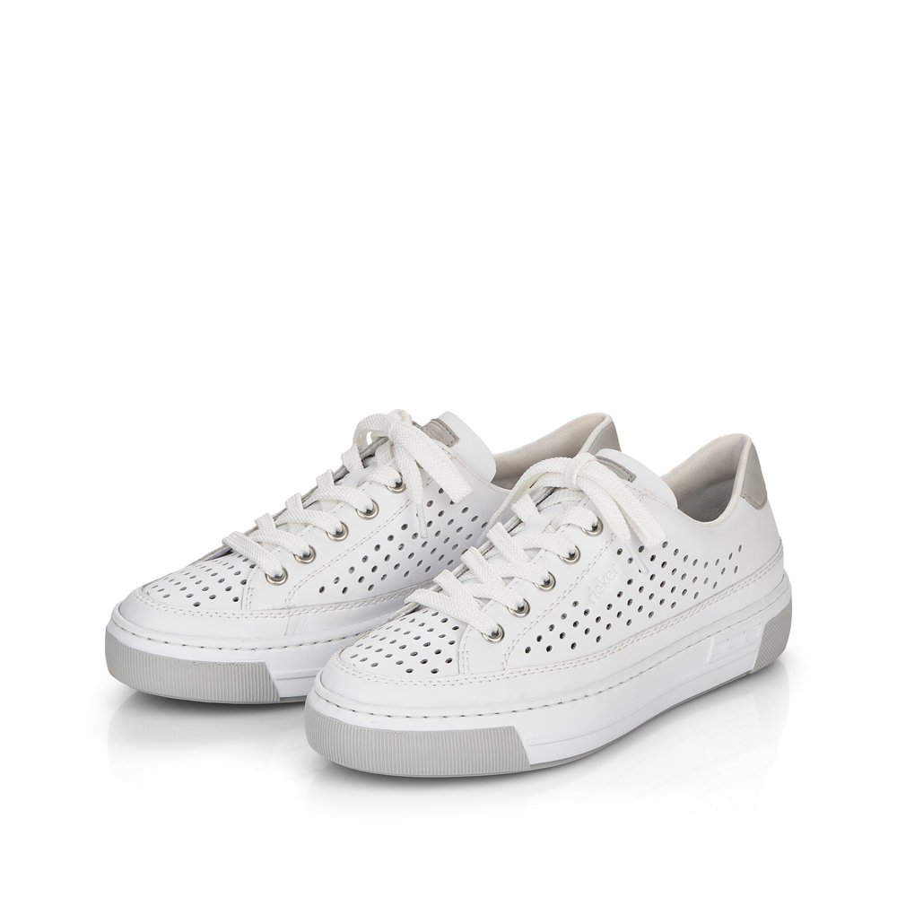 Pure white Rieker women´s low-top sneakers L8849-80 with lacing. Shoes laterally.