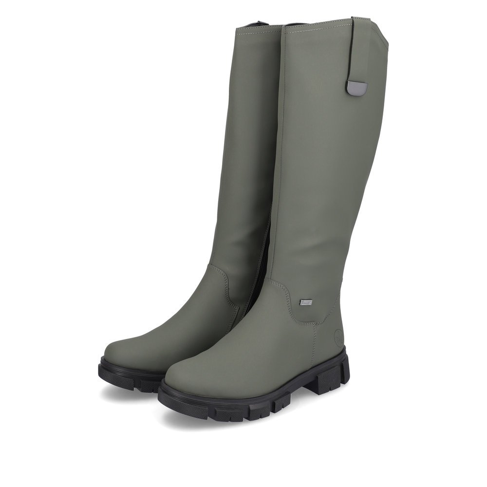 Army green Rieker women´s high boots Y7190-54 with a zipper as well as profile sole. Shoe laterally
