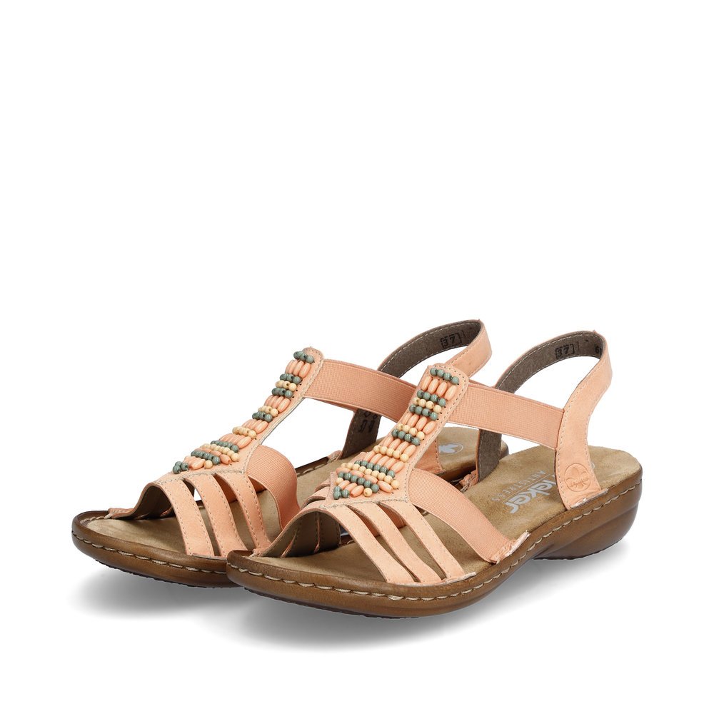 Peach Rieker women´s strap sandals 60851-38 with an elastic insert. Shoes laterally.