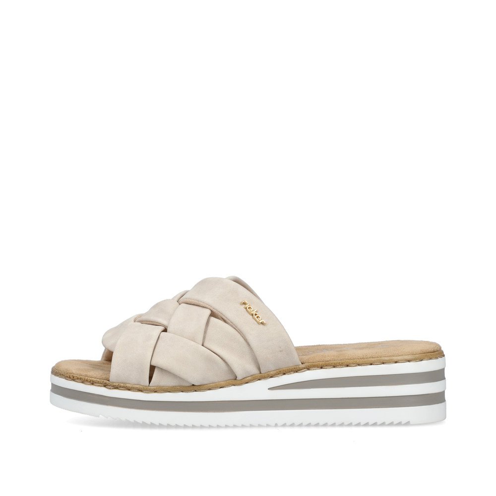 Light beige Rieker women´s mules V0208-60 with the slim fit E 1/2. Outside of the shoe.