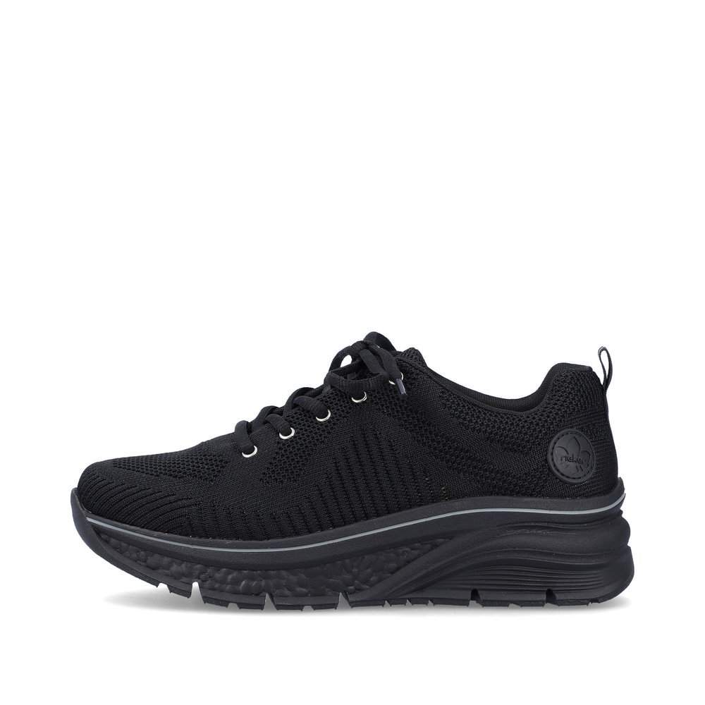 Black Rieker women´s low-top sneakers 48022-00 with a flexible sole. Outside of the shoe.